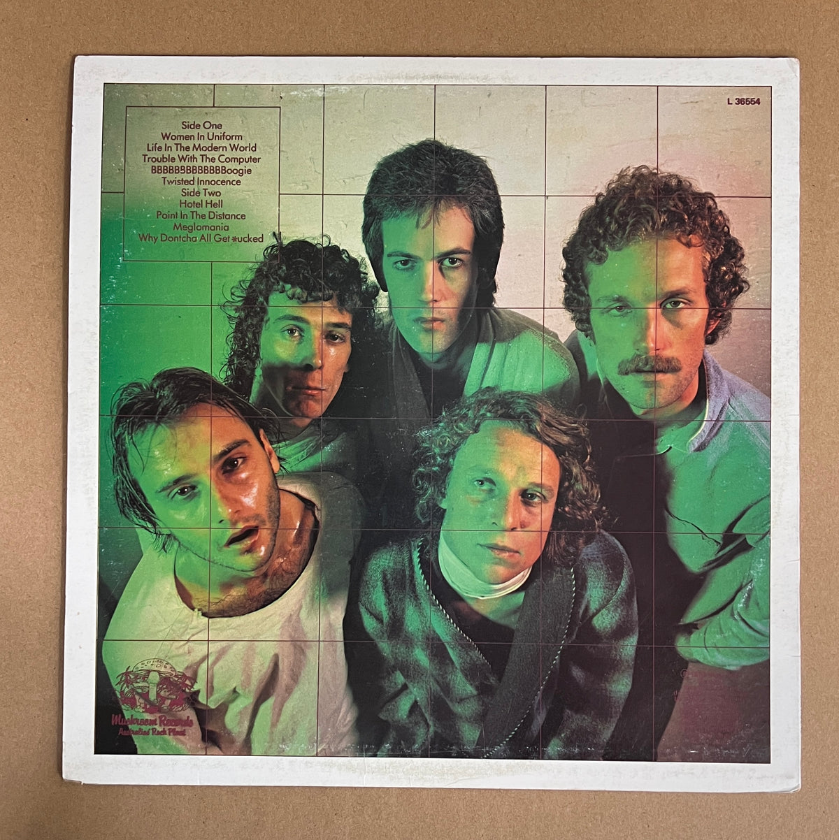 SKYHOOKS - GUILTY UNTIL PROVEN INSANE(LTD EDITION FIRST PRESS ON RED VINYL) SLEEVE - NM / VINYL - NM
